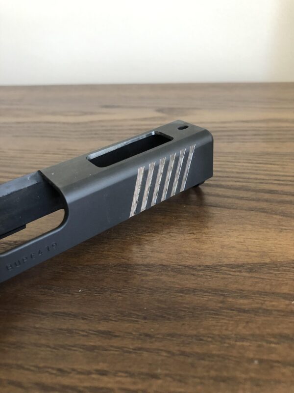 Glock- Enhanced side serrations